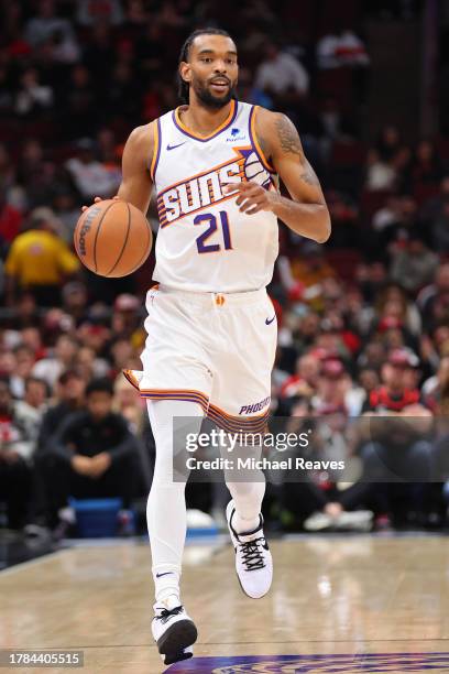 Keita Bates-Diop of the Phoenix Suns dribbles up the court against the Chicago Bulls during the first half at the United Center on November 08, 2023...