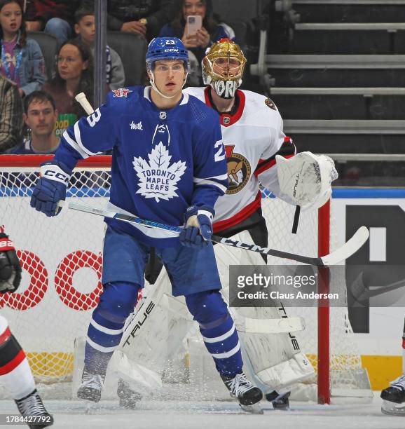 Matthew Knies of the Toronto Maple Leafs looks for a puck to tip in front of Joonas Korpisalo of the Ottawa Senators during the first period of an...