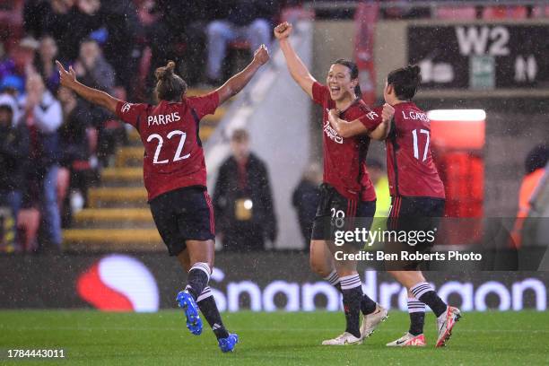 Rachel Williams of Manchester United celebrates with teammates Nikita Parris and Lucia Garcia after scoring the team's first goal during the FA...