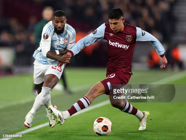 Rodinei of Olympiakos is challenged by Edson Alvarez of West Ham United during the UEFA Europa League 2023/24 match between West Ham United FC and...
