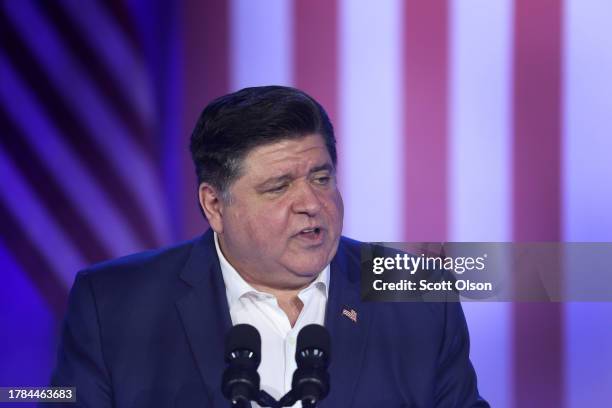 Illinois Gov. J.B. Pritzker speaks to auto workers before the arrival of President Joe Biden at the Community Complex Building on November 09, 2023...