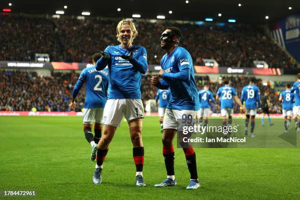 Todd Cantwell of Rangers celebrates with teammate Danilo after scoring the team's second goal during the UEFA Europa League 2023/24 match between...