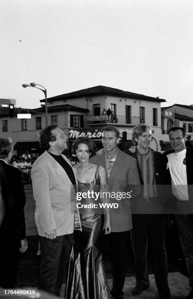 Tom Arnold, Jamie Lee Curtis, Arnold Schwarzenegger, James Cameron, and Bill Paxton attend the premiere of "True Lies" in Westwood, California, on...