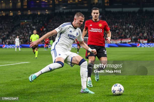Diogo Dalot of Manchester United battles for possession with Vavro Denis of F.C. Copenhagen during the UEFA Champions League match between F.C....