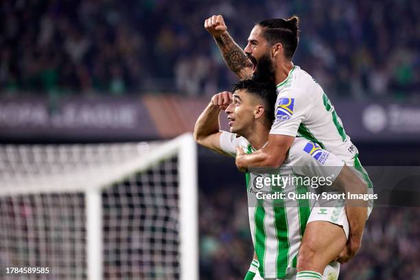 Marc Roca of Real Betis celebrates after scoring their side's third goal with his teammate Isco Alarcon of Real Betis during the UEFA Europa League...