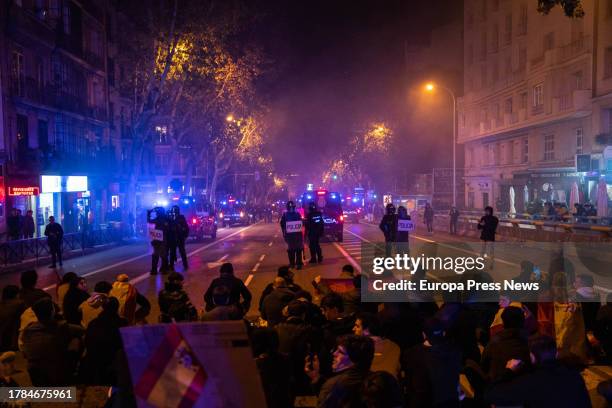 Demonstrators in front of National Police officers during a protest in Ferraz street, on November 9 in Madrid, Spain. Hundreds of people have...