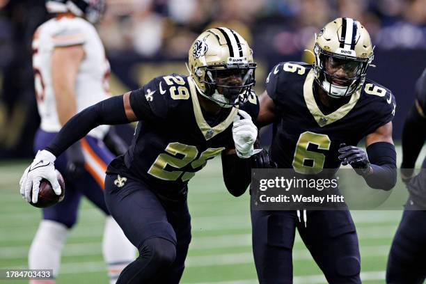 Paulson Adebo of the New Orleans Saints celebrates after intercepting a pass during a game against the Chicago Bears at Caesars Superdome on November...