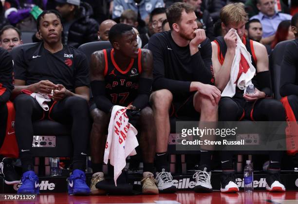 Late in the game, four of the five starters watch from the bench, Toronto Raptors forward Scottie Barnes , Toronto Raptors guard Dennis Schroder ,...