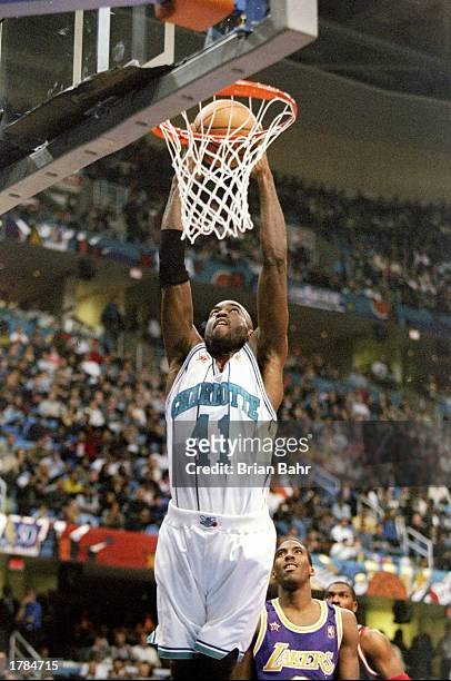 Guard Glen Rice of the Charlotte Hornets goes up for two as guard Eddie Jones of the Los Angeles Clippers looks on during the NBA All-Star game at...