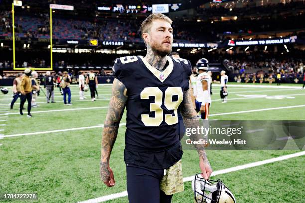 Lou Hedley of the New Orleans Saints walks off the field after a game against the Chicago Bears at Caesars Superdome on November 5, 2023 in New...