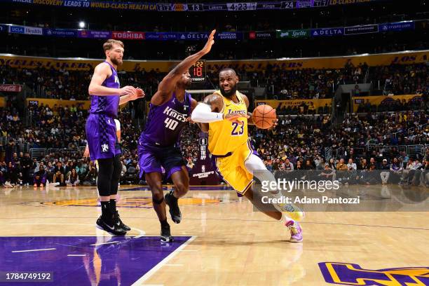 LeBron James of the Los Angeles Lakers drives to the basket during the game against the Sacramento Kings on November 15, 2023 at Crypto.Com Arena in...