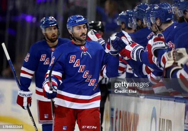 Vincent Trocheck of the New York Rangers celebrates his goal with teammates on the bench during the first period against the Minnesota Wild at...