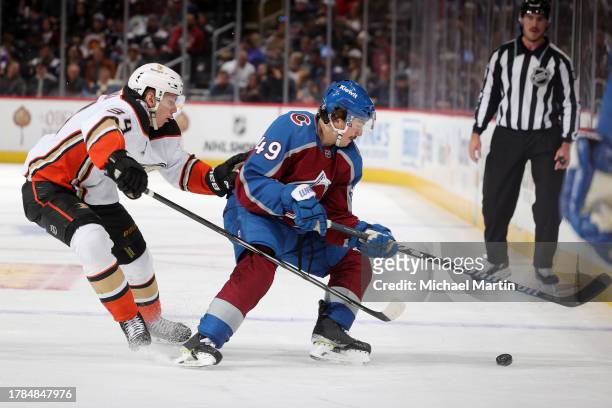 Samuel Girard of the Colorado Avalanche skates against Pavel Mintyukov of the Anaheim Ducks at Ball Arena on November 15, 2023 in Denver, Colorado.