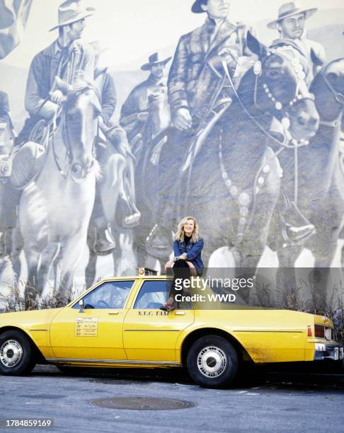 Oscar nominated costume designer Jacqueline West poses for a portrait on a NYC taxi against a wall on a backlot in Los Angeles, California in March...