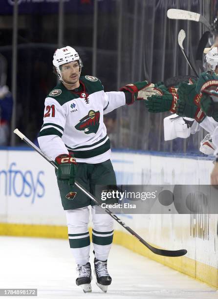 Brandon Duhaime of the Minnesota Wild celebrates his goal with teammates on the bench in the second period against the New York Rangers at Madison...