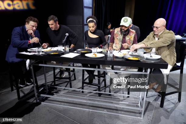 Rocco DiSpirito, Ryan Zimmerman, Fariyal Abdullahi, Justin Sutherland and Tom Colicchio taste food onstage during Capitol Food Fight 2023 at The...