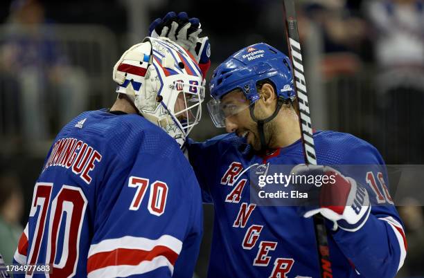 Louis Domingue of the New York Rangers is congratulated by Vincent Trocheck after the game against the Minnesota Wild at Madison Square Garden on...