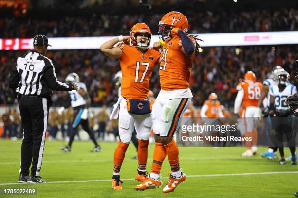 Onta Foreman of the Chicago Bears celebrates with Tyson Bagent after a touchdown during the third quarter against the Carolina Panthers at Soldier...
