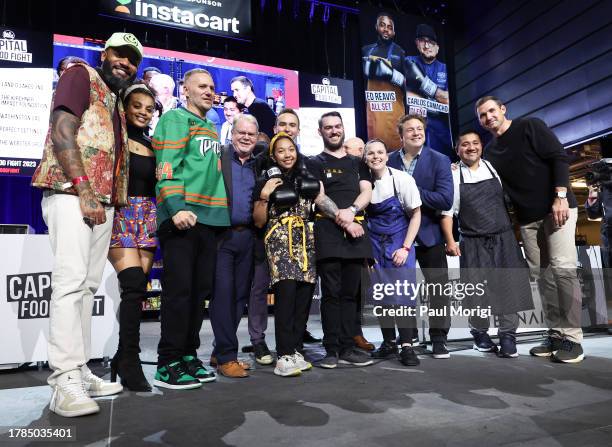 Celebrity chefs and battling chefs pose for a group photo onstage during Capitol Food Fight 2023 at The Anthem on November 09, 2023 in Washington, DC.