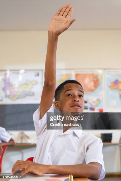 Key Raising Hand One Kid Raising Hand In Class Photos and Premium High Res Pictures ...