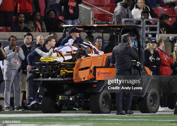 Perris Jones of the Virginia Cavaliers is taken off the field after being injured in the game against the Louisville Cardinals at Cardinal Stadium on...