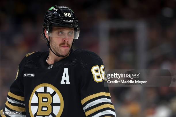 David Pastrnak of the Boston Bruins looks on during the third period against the New York Islanders at TD Garden on November 09, 2023 in Boston,...