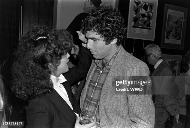 Jennifer Bogart and Elliott Gould attend a party, celebrating the release of Cheryl Tiegs' book "The Way to Natural Beauty," at Robert Evans' home in...