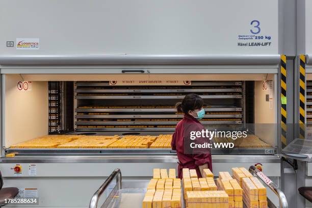 Female employee moves wax moldes into storage at the new Pandora facility in Lamphun, Thailand, April 23, 2018.