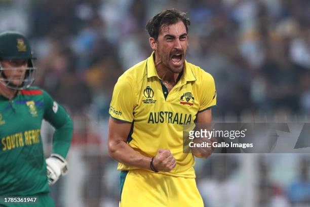 Australia's Mitchell Starc celebrates the wicket of Aiden Markram of South Africa during the ICC Men's Cricket World Cup 2023 semi final match...