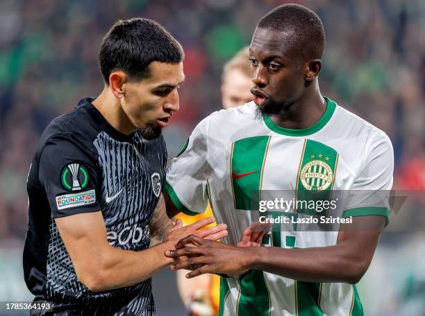 Ibrahim Cissé of Ferencvarosi TC argues with Daniel Munoz of KRC Genk during the UEFA Europa Conference League Group Stage match between Ferencvarosi...