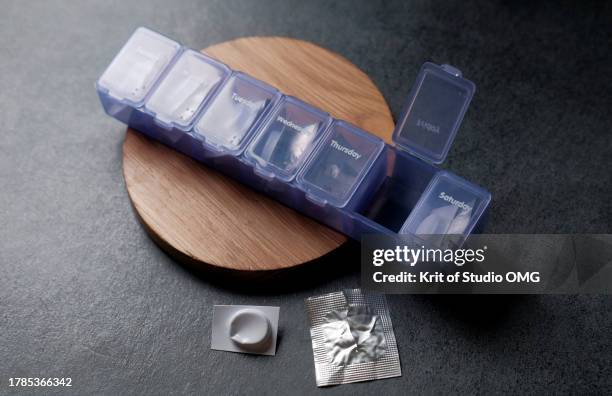 daily pill boxes help prevent you from forgetting to take your medicine - opening week stock pictures, royalty-free photos & images