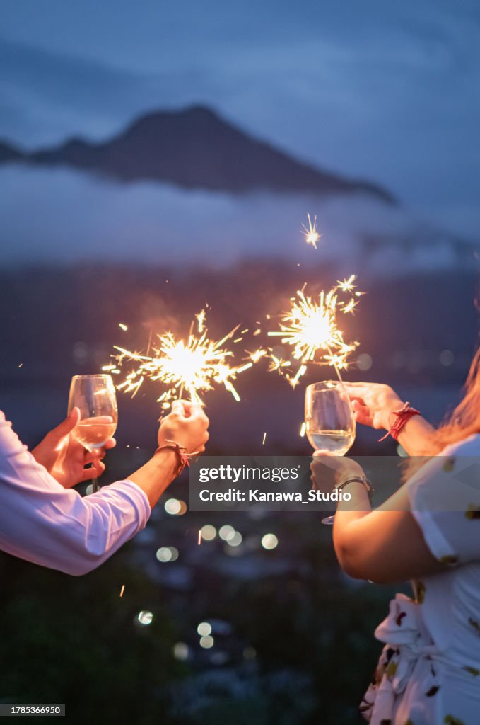 Unrecognizable Couple celebrating New year's eve in the mountain
