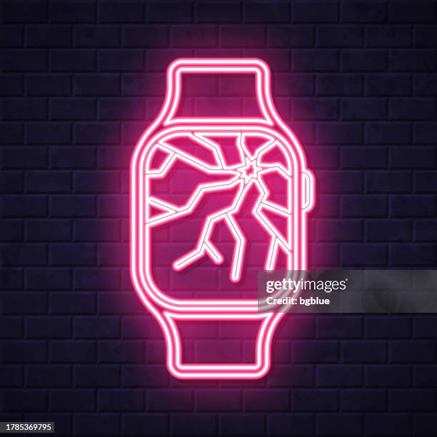 smartwatch with broken screen. glowing neon icon on brick wall background - broken clock stock illustrations