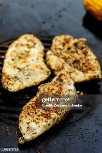 chicken bruscetta with vegetables cooking on an outdoor grill - grilled chicken stock pictures, royalty-free photos & images
