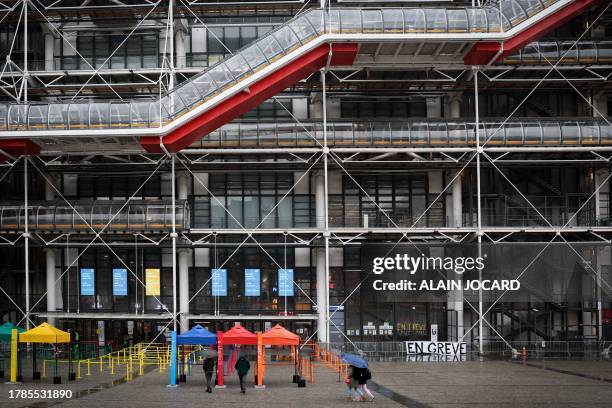 Banner reading "On strike" is displayed at the entrance doors of the Centre Pompidou in Paris, on November 16, 2023. French Minister of Culture, Rima...