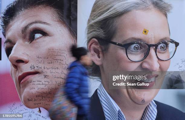 Woman walks past a tabloid newspaper billboard showing far-left politician Sahra Wagenknecht and far-right Alternative for Germany co-leader Alice...