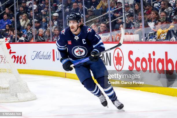 Adam Lowry of the Winnipeg Jets follows the play around the net during third period action against the Nashville Predators at the Canada Life Centre...