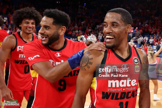 Bryce Cotton of the Wildcats looks on with Corey Webster after winning the round seven NBL match between Perth Wildcats and New Zealand Breakers at...