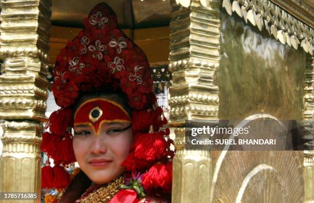 Former Nepalese Kumari, or living goddess Preeti Shakya weeps as she leaves the ornate Kumari House to go back to her own family after her term as...