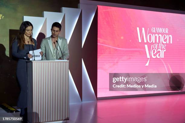 Host Paulina Dávila and Darío Yazbek speak during the ceremony 2023 Women of the Year, of Glamour Magazine at Hotel St. Regis on November 9, 2023 in...