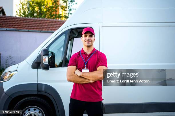 male courier in front of a delivery van - advanced driver assistance systems stock pictures, royalty-free photos & images