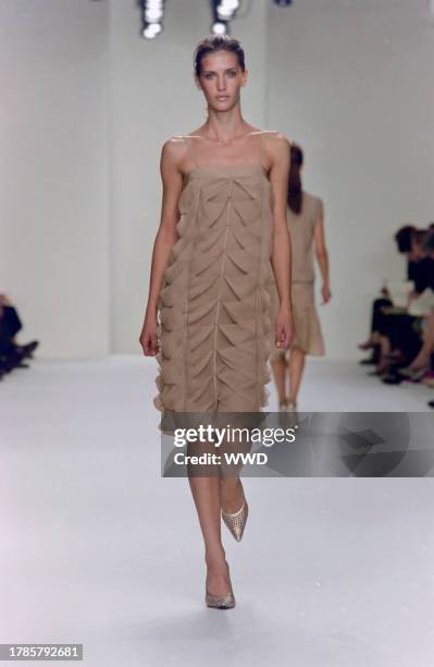 This is the first collection designed by Francisco Costa following Calvin Klein's departure from his eponymous label in the fall of 2003. Model Diana...