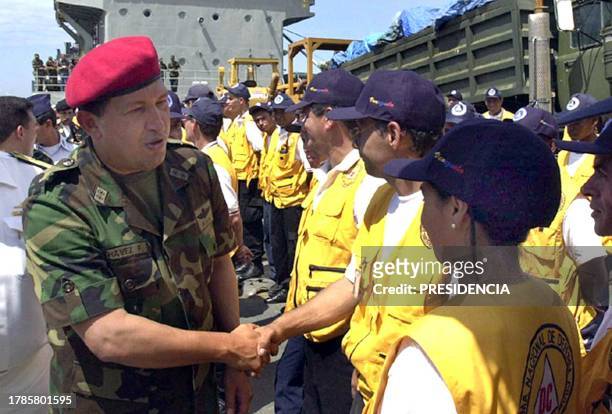 Venezuelan President Hugo Chavez greets civilian and military volunteers upon their return from disaster relief work in earthquake-torn El Salvador,...