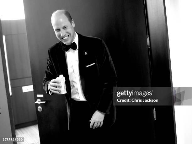 Prince William, Prince of Wales laughs as he drinks some water backstage during the 2023 Earthshot Prize Awards Ceremony on November 07, 2023 in...