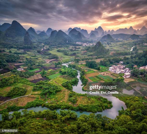 sunset landscape of guilin , li river and karst mountains called cuiping or five finger mount located at yangshuo county, guilin, guangxi province, china - china stock pictures, royalty-free photos & images