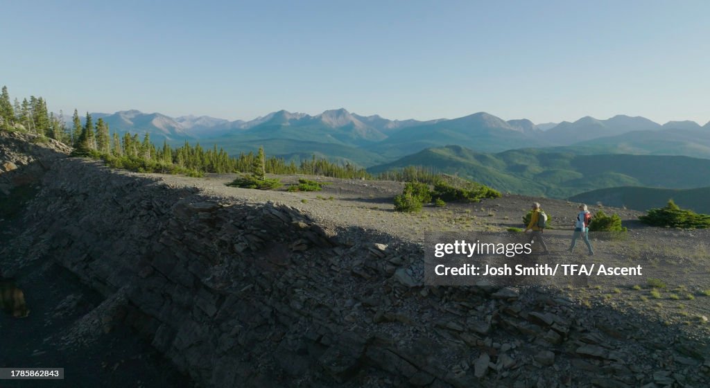 Intersect Mountain Ridge Aerial View Of Couple Exploring High Mountain Ridge High-Res Stock ...