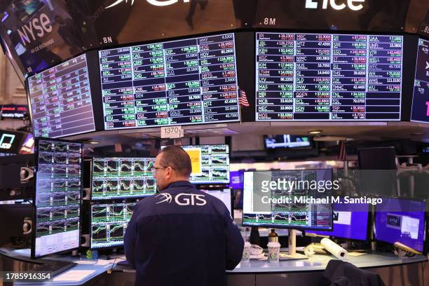 Traders work on the floor of the New York Stock exchange during morning trading on November 10, 2023 in New York City. Stocks rose during the opening...