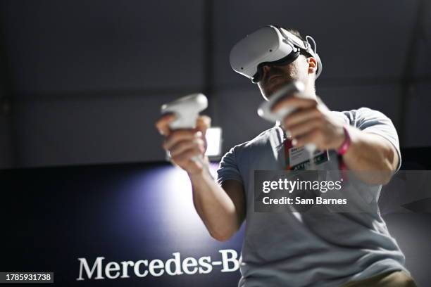 Lisbon , Portugal - 16 November 2023; An attendee uses VR goggles during day three of Web Summit 2023 at the Altice Arena in Lisbon, Portugal.