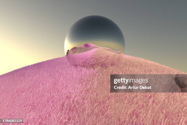 metallic sphere reflecting the digital surreal landscape with pink grass from another dimension. - mercurio fotografías e imágenes de stock