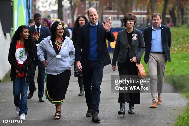 Britain's Prince William, Prince of Wales waves to well-whithers as he visits the Millennium Powerhouse, a multi-service youth hub which works with a...